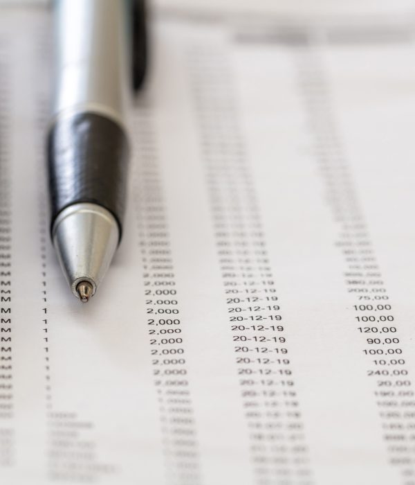 Financial accounting. Pen and calculator on business report